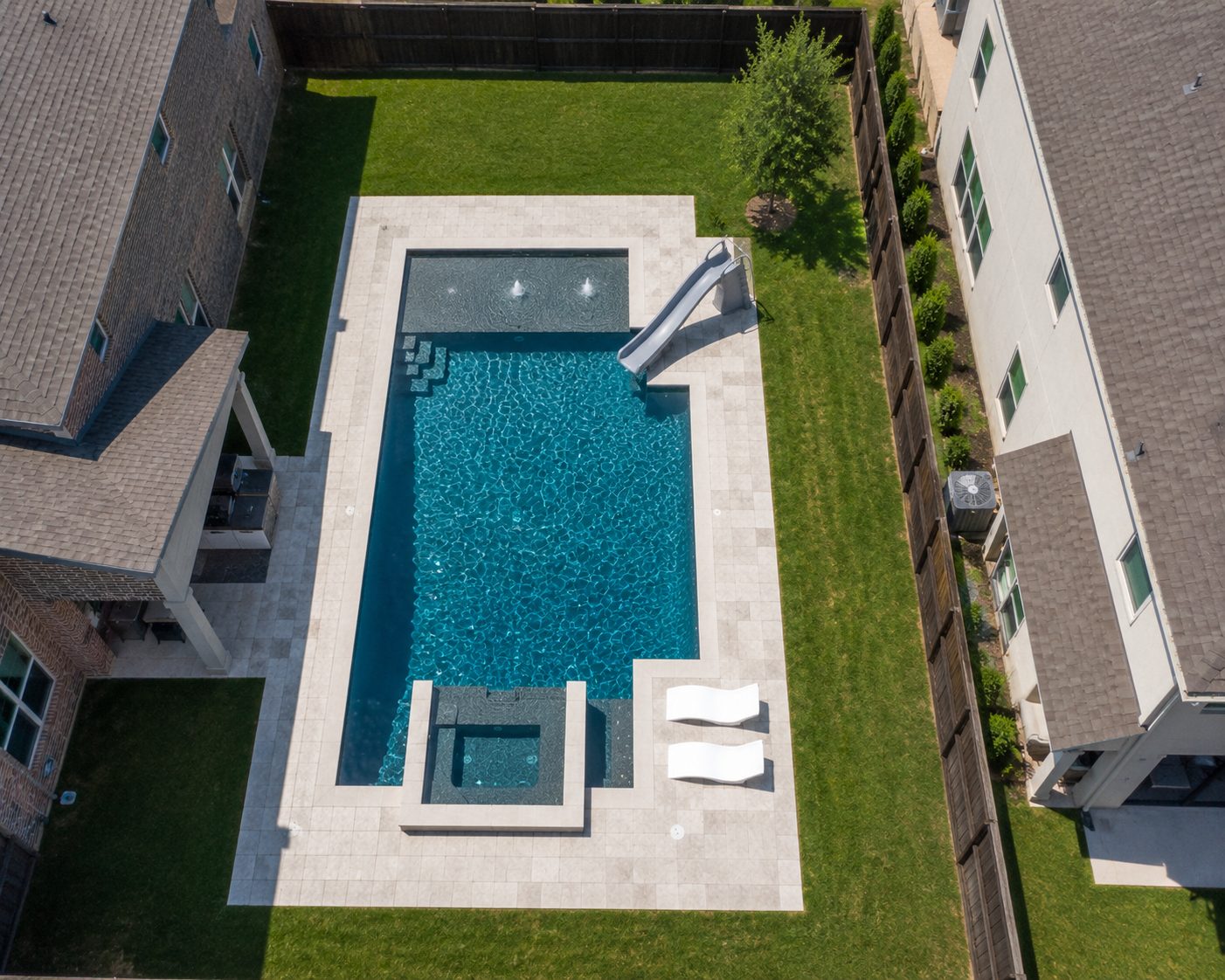 Aerial view of pool with spa, fountains and slide